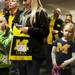 Seven-year-old Evie Whitcomb from Ann Arbor takes a peak at Michigan senior quarterback Denard Robinson as he signs autographs at The M-Den on Saturday, Feb. 2. Daniel Brenner I AnnArbor.com
